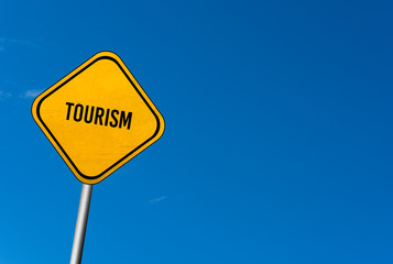 Naklejka premium tourism - yellow sign with blue sky