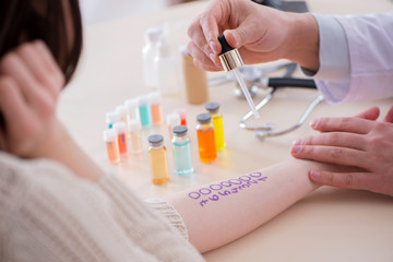 Doctor testing allergy reaction of patient in hospital