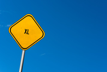 xl - yellow sign with blue sky