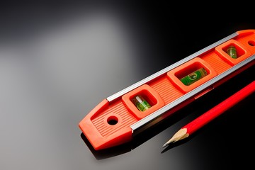 Optical level lies on the surface of the floor