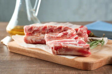 Fresh raw pork ribs on wooden board