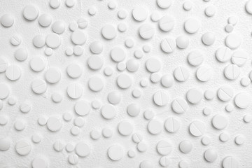 Pills on white background, flat lay