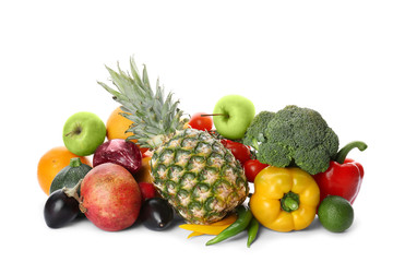 Rainbow collection of ripe fruits and vegetables on white background