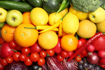 Rainbow collection of ripe fruits and vegetables as background, top view