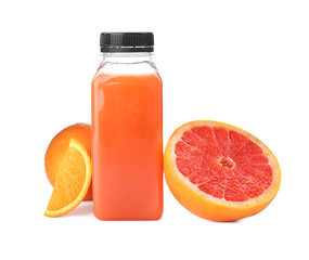 Bottle with healthy detox smoothie and citrus fruits on white background