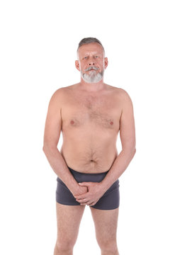 Mature man with urological problems on white background