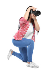 Female photographer with professional camera on white background