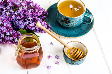 Organic honey in glass jar, purple lilac