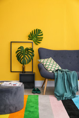 Elegant living room interior with comfortable sofa. Home design in rainbow colors