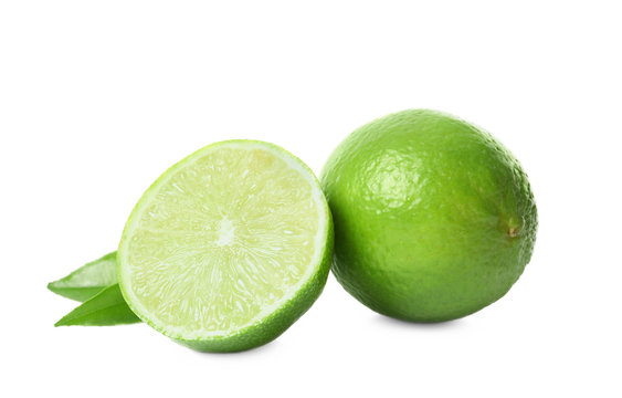 Fresh ripe green limes on white background