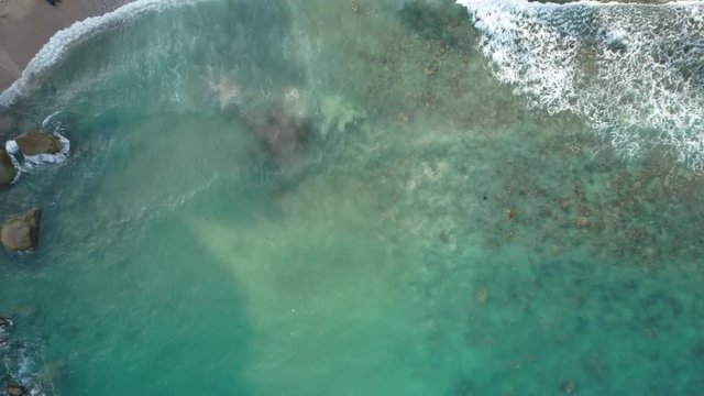 Drone footage. Thailand. Koh Phangan island. Haad tien beach. Top view aerial video of beauty nature landscape with beach, sea and jungle.