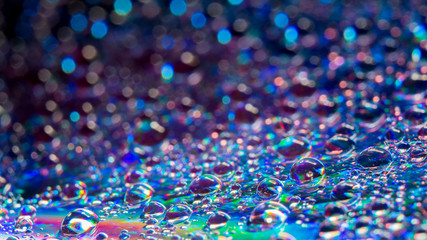 Water drops on the DVD, abstract view, selective focus, low light, underexposed, blur. Best for wallpaper and background use.