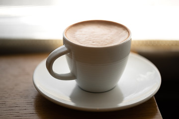 Morning cappuccino by a Window