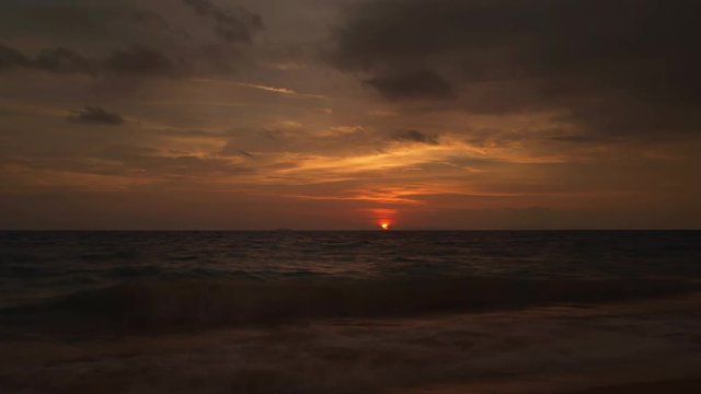 Picturesque timelapse of sun setting over Andaman sea.