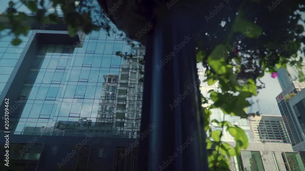 Poster reflection of another building in a downtown skyscraper mirror windows