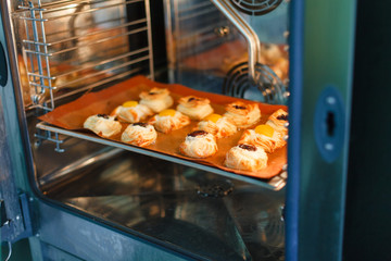French sweet pastries in a professional oven - 205711424