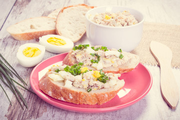 Vintage photo, Baguette with mackerel or tuna fish paste with egg and chives