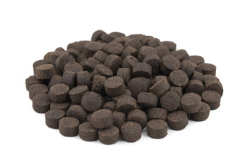 Heap of Khatti Mithi Vati Indian Traditional Digestive Food Good to Eat After Lunch or Dinner, Also Serve in Festival of Diwali, Holi, And For Guest. isolated on white background