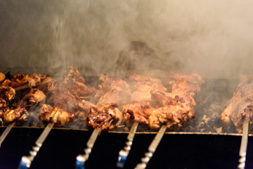Meat grilled over charcoal