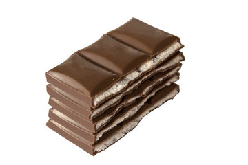 Stack of milk chocolate bar slices isolated on white background.
