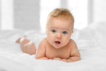 Portrait  baby on the bed - 205714828