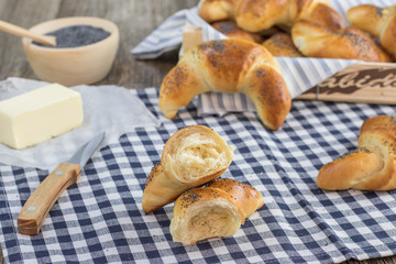 Halver poppy seed croissant with butter