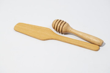 honey dipper and spoon on the white background