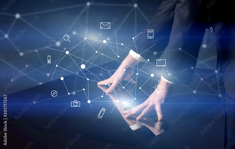 Poster male hands touching interactive table with blue mixed communication icons in the background