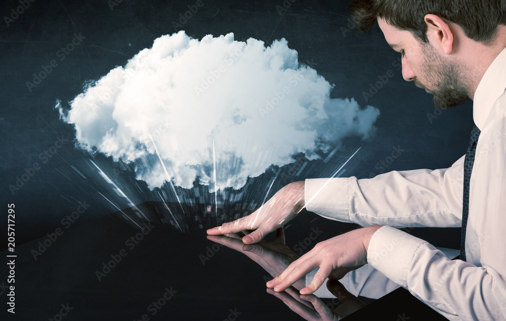 Poster male hands touching interactive table with a white cloud on it