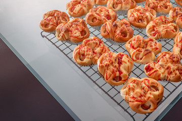 Baked pork sausage with mayonnaise bread on a wire cooking rack , for cooled before separate packing