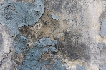 Obraz na płótnie Canvas Blue paint peeling plaster gunge wall.