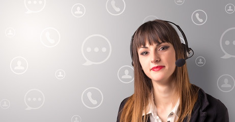 Young female telemarketer with white speech bubbles around her