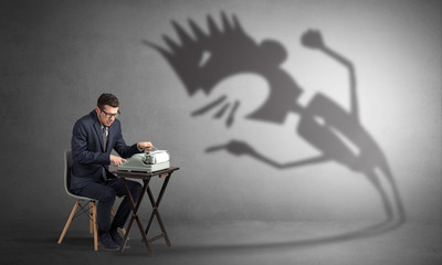 Man working hard and he is afraid of a yelling shadow
