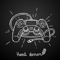 Hand drawn gamepad on black background. Vector illustration. © Happy Illustrator