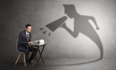 Hard working businessman shadow yelling to himself concept
