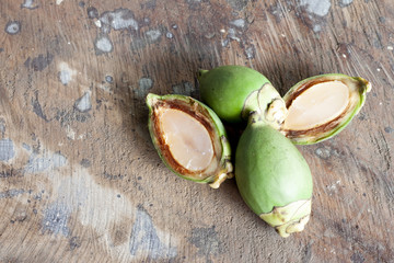 foxtail palm fruit on wooden floor for background, Soft fruit to boil syrup ready to eat, Dissect of Fruit soft.