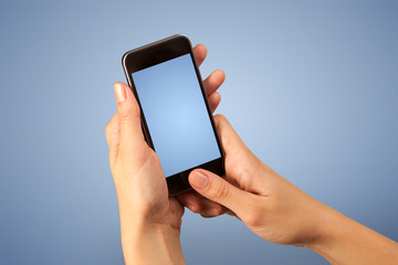 Female fingers touching blank smartphone