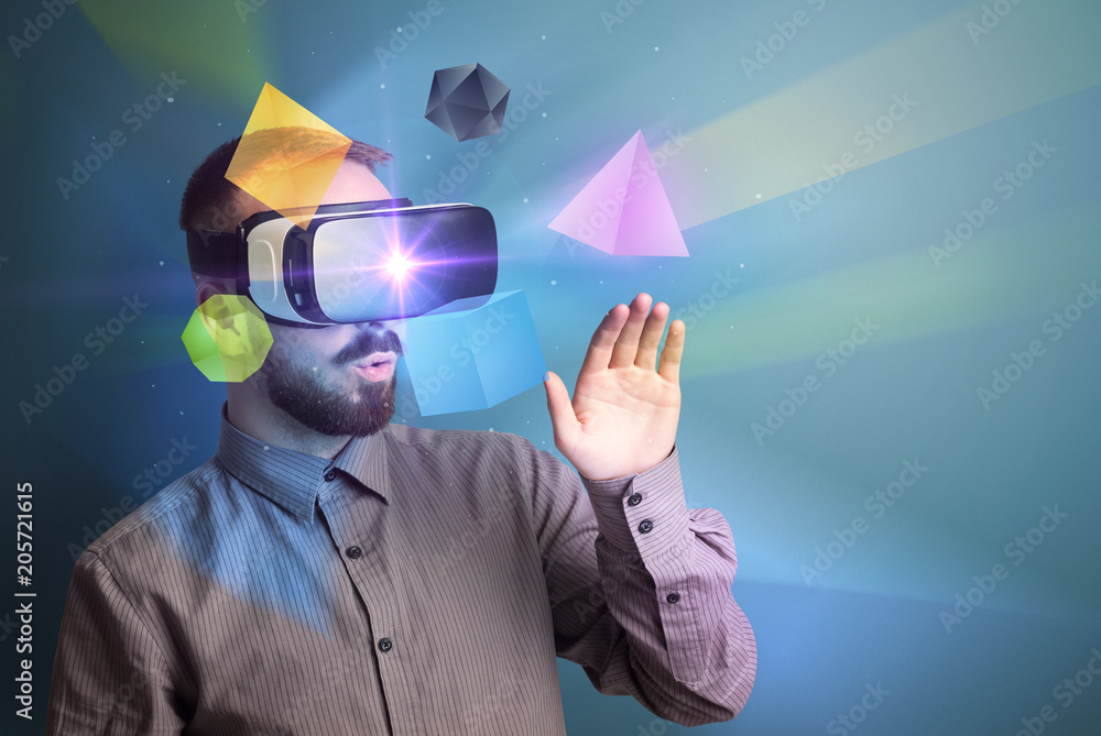 Poster amazed businessman with virtual reality colorful geometric shapes in front of him