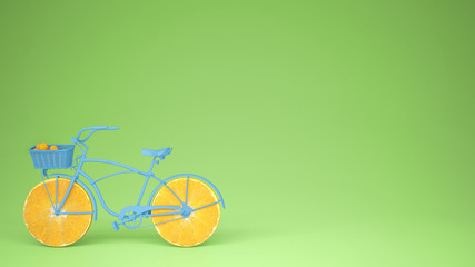 Blue bike with sliced orange wheels, healthy lifestyle concept with green pastel background copy space