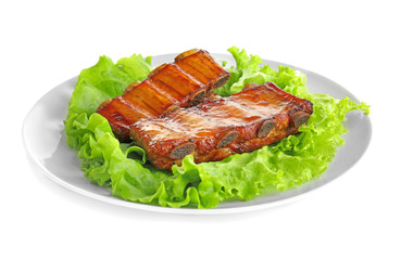 Plate with delicious grilled ribs on white background