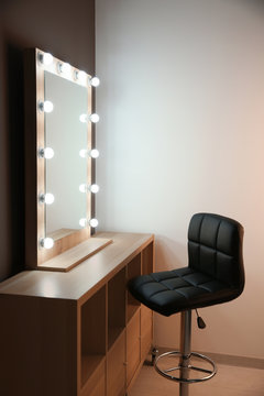 Workplace of professional makeup artist with large mirror