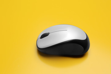 Wireless computer mouse on color background