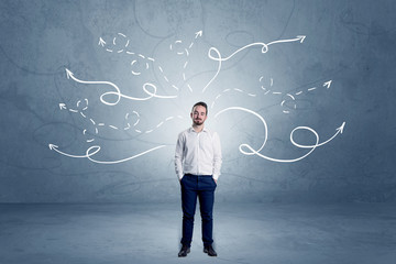 Elegant businessman choosing between directions with winding drawn arrows around 
