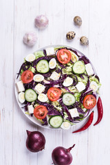 Salad with cabbage and quail eggs