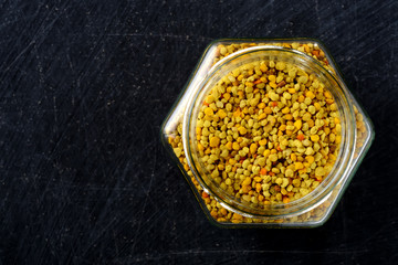 Flower pollen on a dark background. Apitherapy.