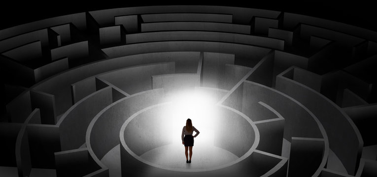 Woman can not decide which entrance to chose in a middle of a dark maze
