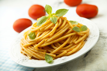 Pasta with tomato sauce and fresh basil