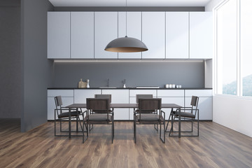 Gray dining room and kitchen interior, front view