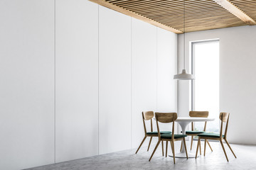 Corner of a modern white dining room