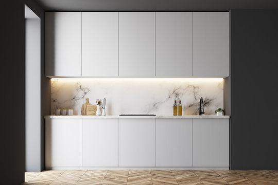 White and black counterops in kitchen